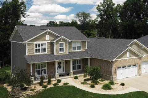 Two-story home finished in weathered gray architectural asphalt shingles