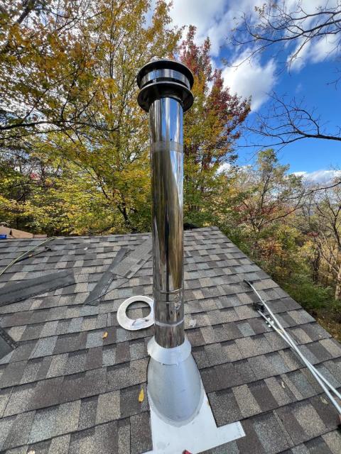 Pipe boot and storm collar on a newly shingled roof