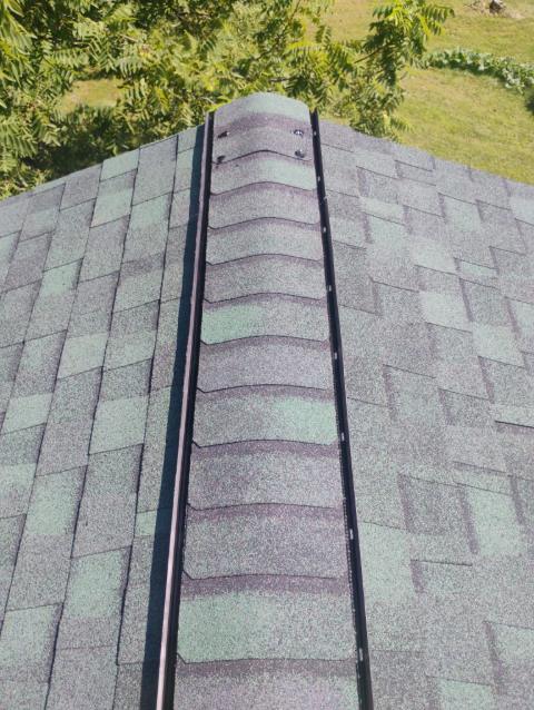 Ridge vent covered with cap shingles
